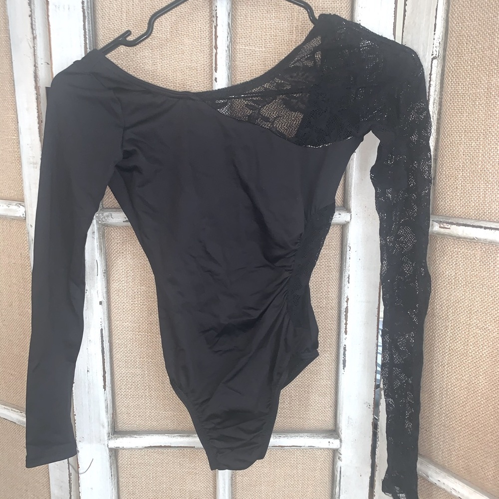 Natalie Dancewear long sleeve , lace details . Scoop back , lined front Small